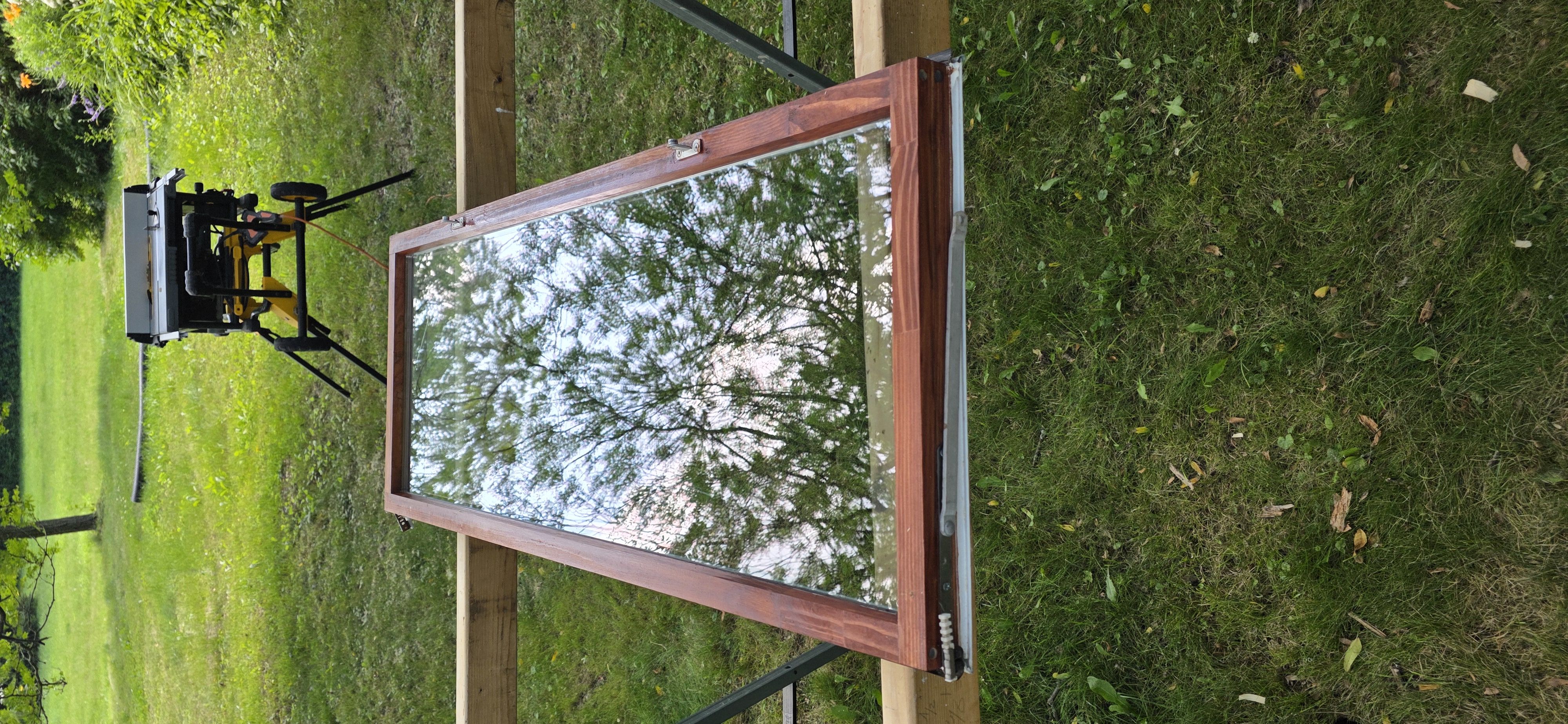 Professional window repair specialist working on wooden window frame